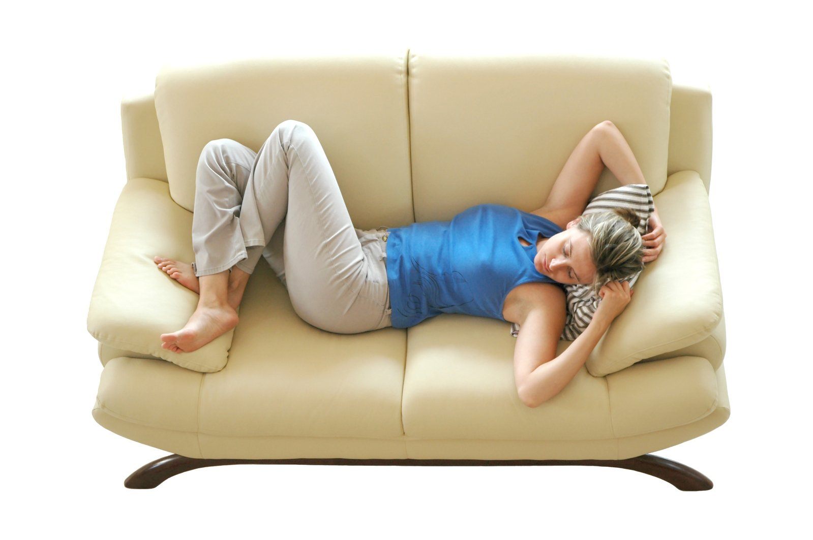 Woman relaxing on the couch of her media room.